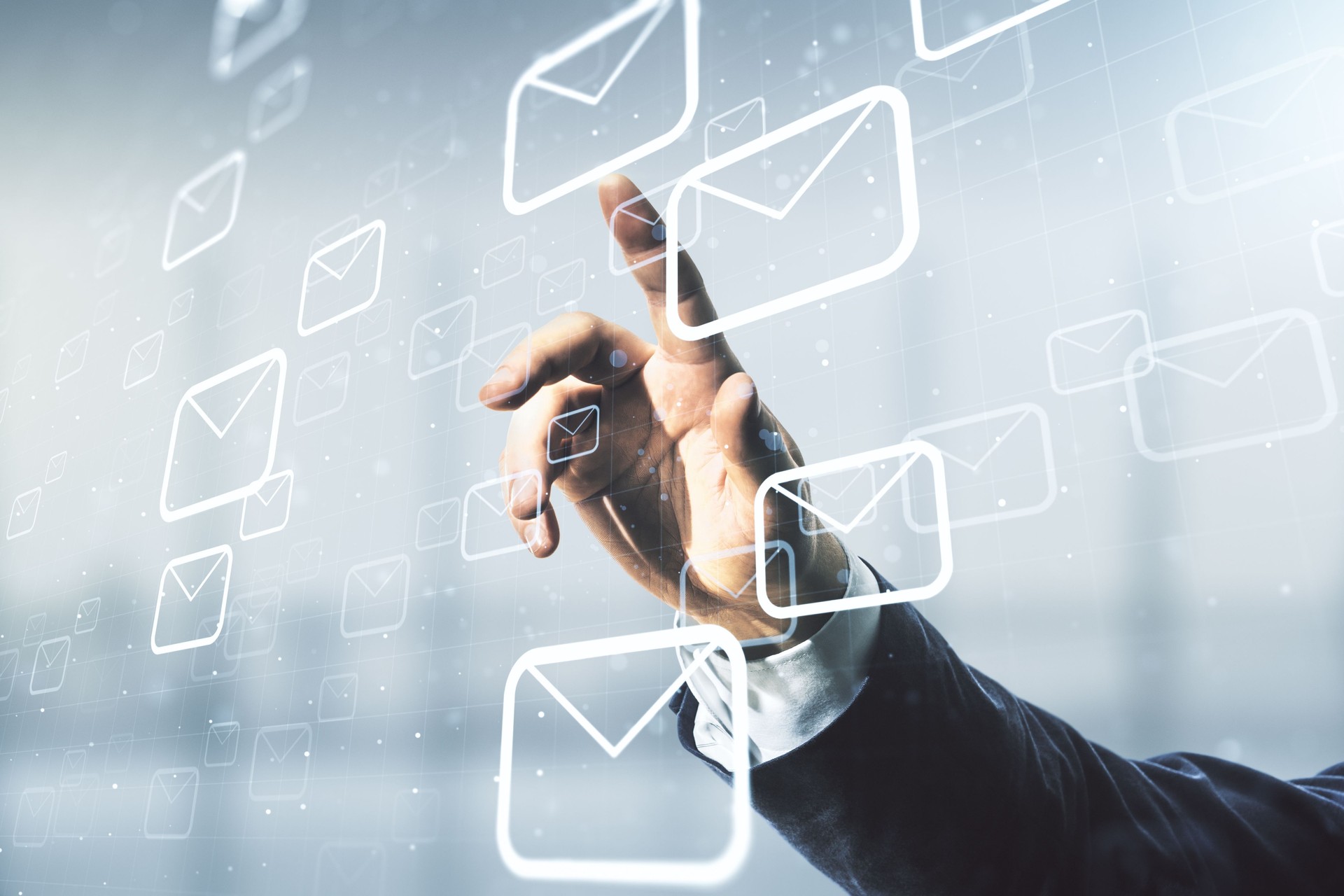Male hand working with abstract virtual postal envelopes sketch on blurred office background, e-mail and marketing concept. Double exposure